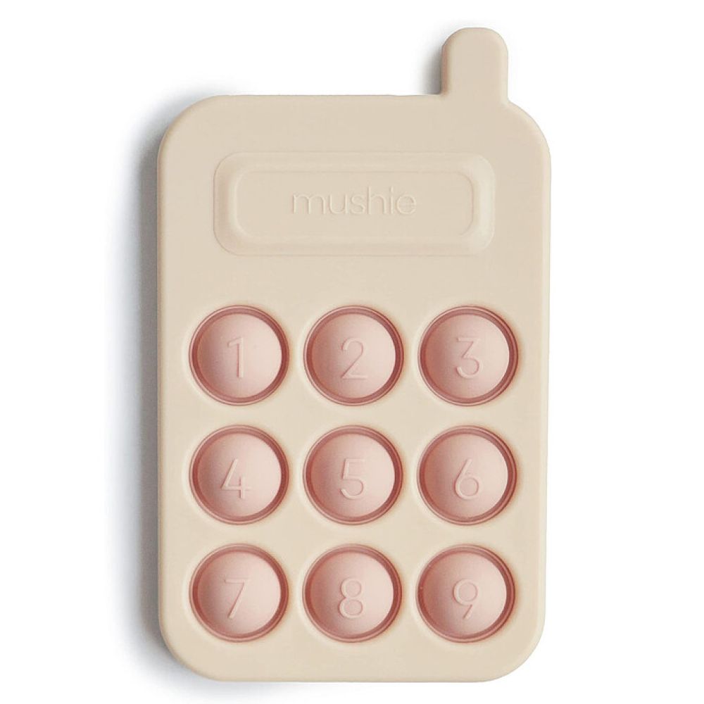 Jouet à presser téléphone rose Mushie