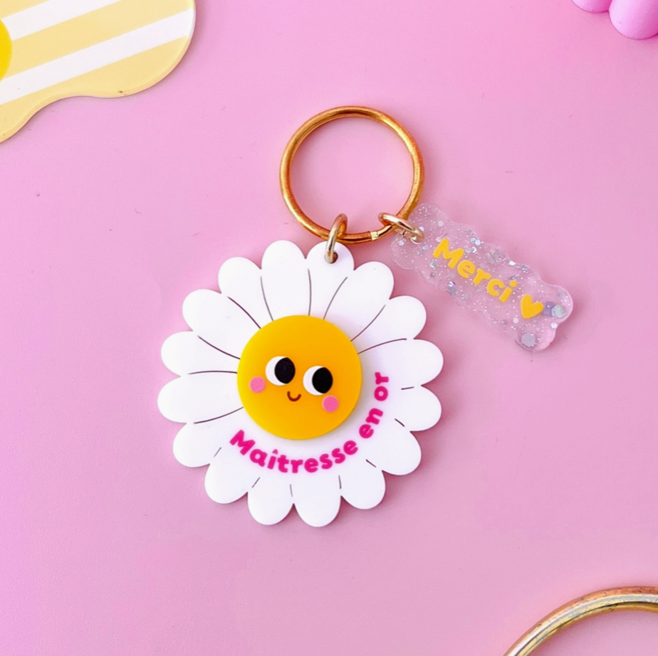 porte clés fleur maitresse en or