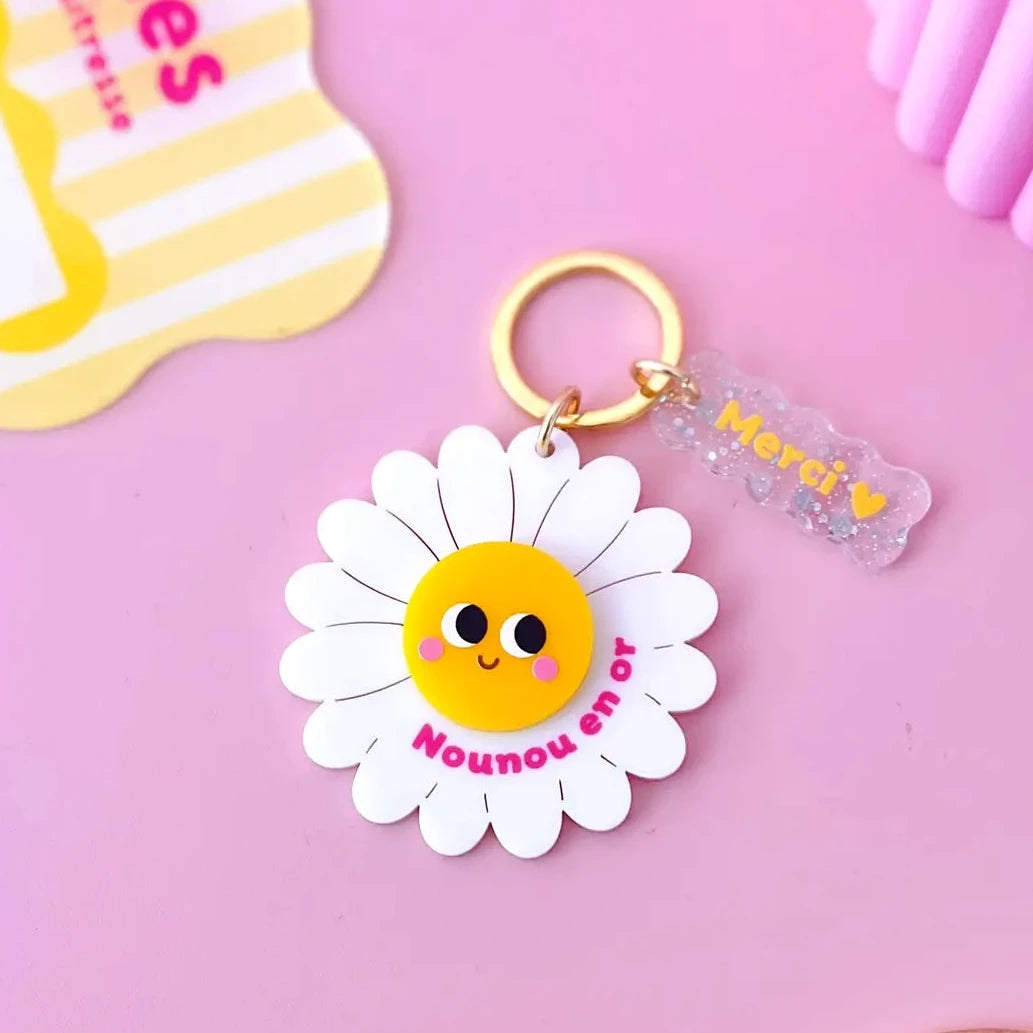 porte clés fleur nounou en or